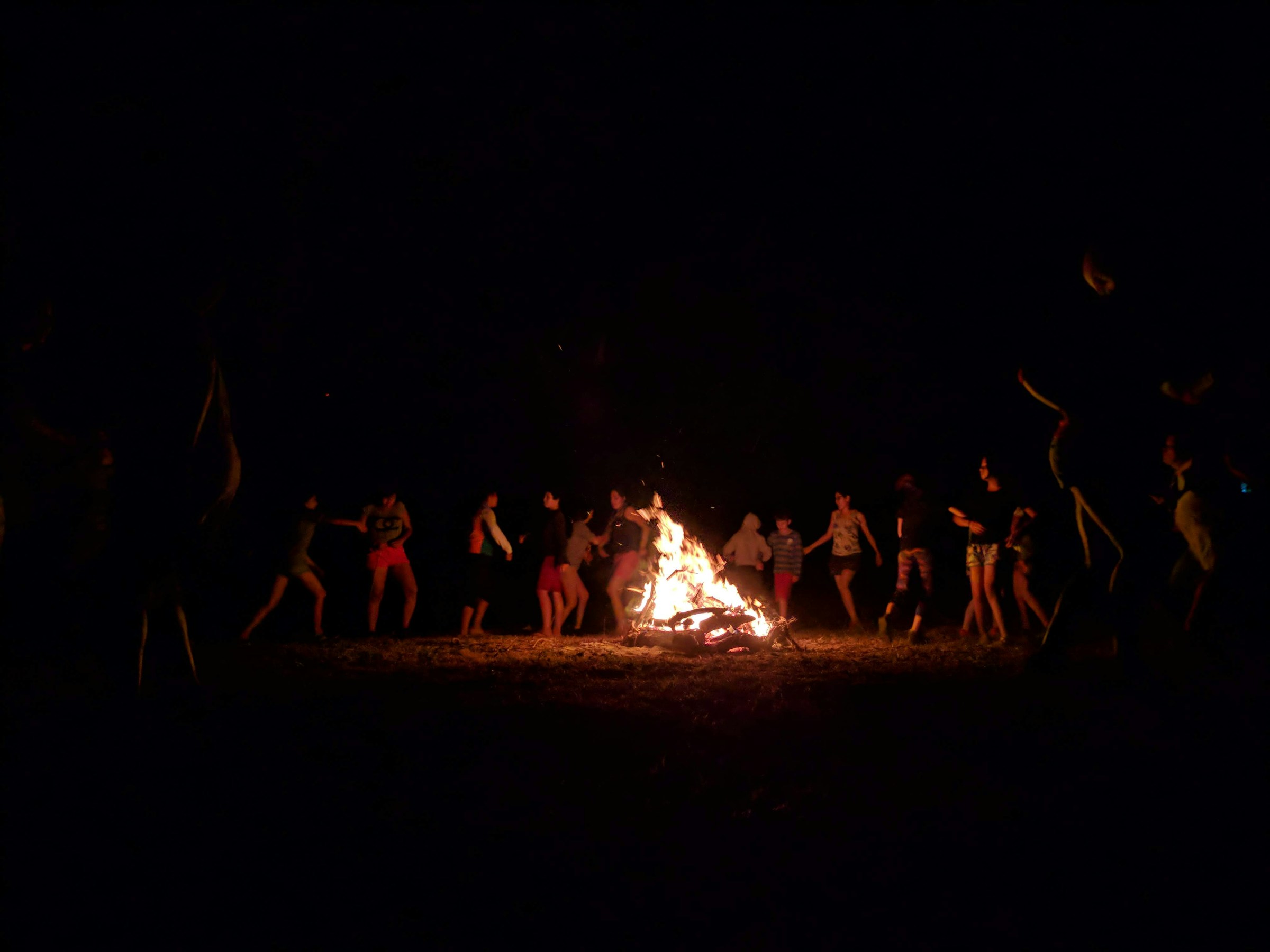 Bonfire night under a starry sky at Nirvana wild camp